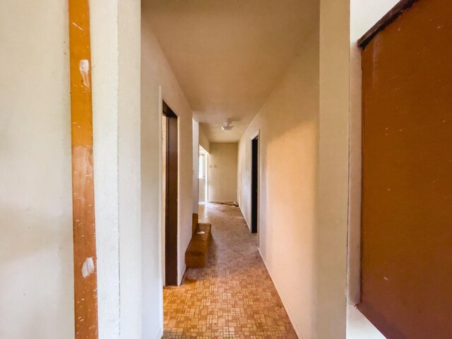 corridor featuring light tile patterned floors