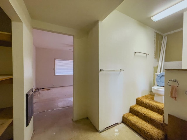 staircase with concrete flooring