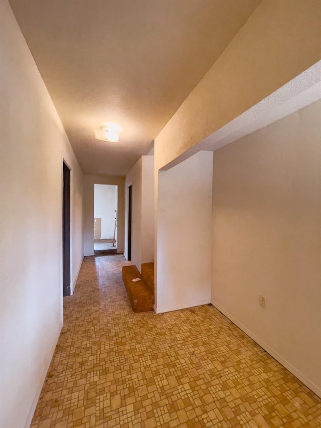 hallway with light tile patterned floors