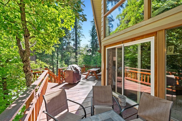 wooden deck featuring grilling area