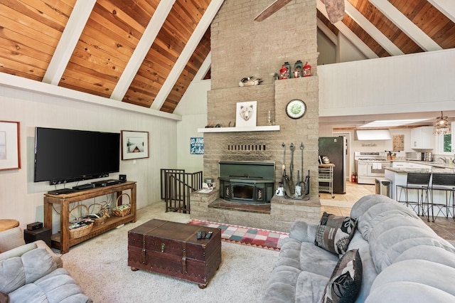 carpeted living room with brick wall, high vaulted ceiling, beam ceiling, wooden ceiling, and a fireplace