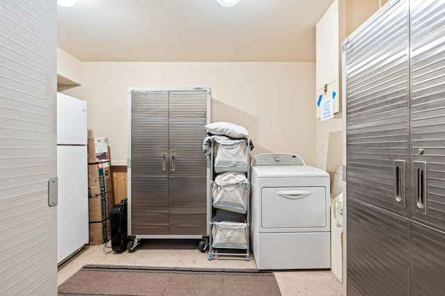 laundry room with washer / dryer