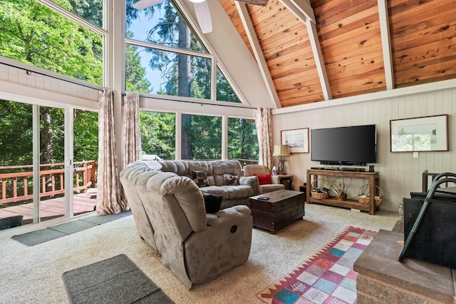 living room with beamed ceiling, high vaulted ceiling, wood ceiling, and light carpet