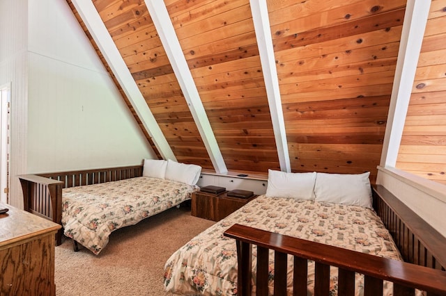 bedroom featuring carpet, lofted ceiling with beams, and wood ceiling