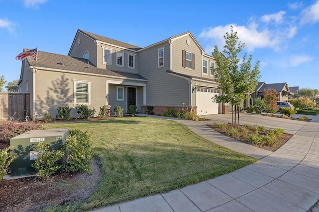 front facade featuring a garage and a front lawn