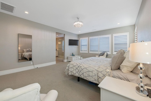 carpeted bedroom featuring a chandelier