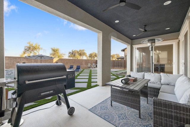 view of patio with grilling area, ceiling fan, and an outdoor living space