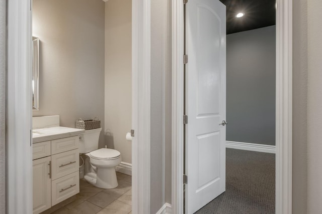 bathroom featuring vanity, toilet, and tile patterned floors