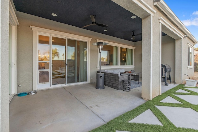 view of patio featuring an outdoor living space and ceiling fan