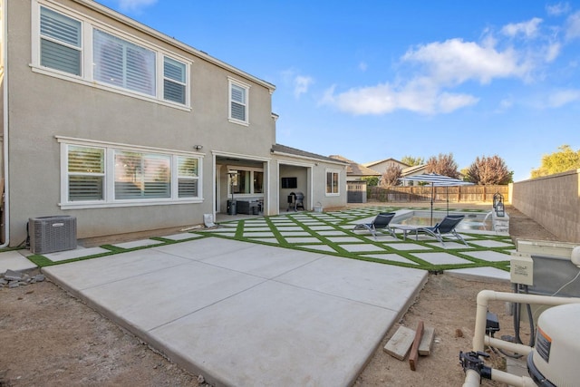 back of property featuring a patio area and central air condition unit