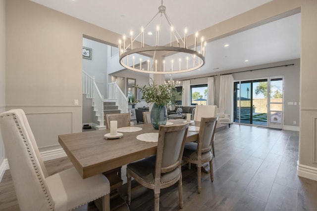 dining space featuring a notable chandelier and hardwood / wood-style floors