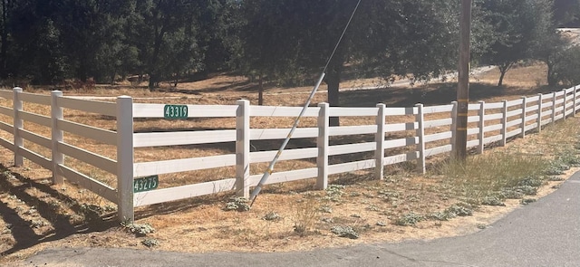 view of gate featuring a rural view