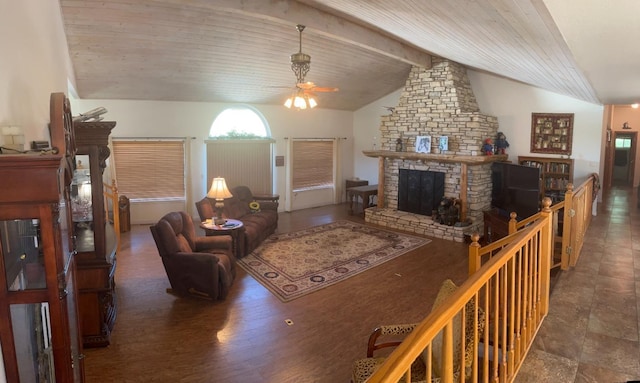 living room featuring wooden ceiling, a fireplace, ceiling fan, and vaulted ceiling with beams