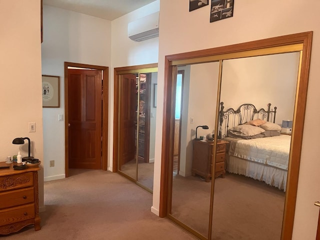 carpeted bedroom with a high ceiling and a wall mounted air conditioner