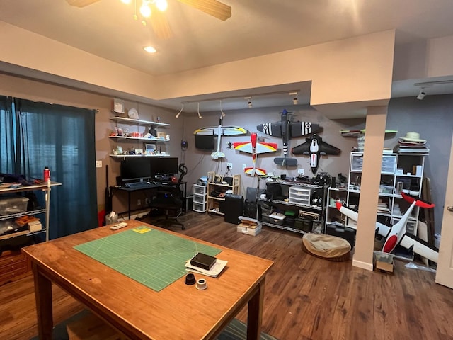 office with ceiling fan and dark wood-type flooring