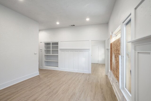 unfurnished living room featuring light wood-type flooring