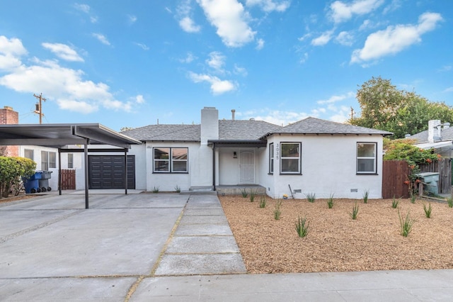 view of front of home featuring a carport and a garage