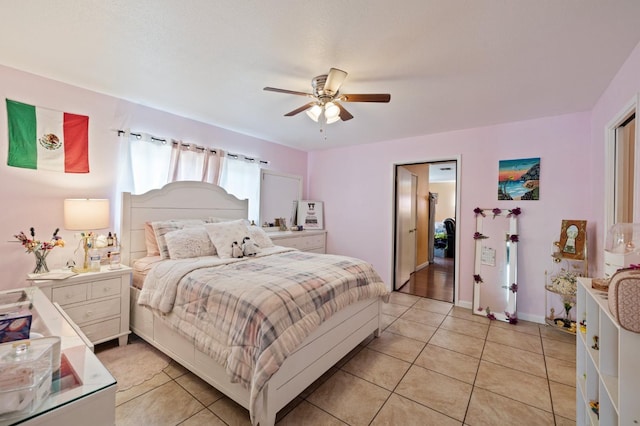 tiled bedroom with ceiling fan