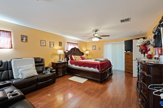 bedroom featuring hardwood / wood-style flooring and ceiling fan