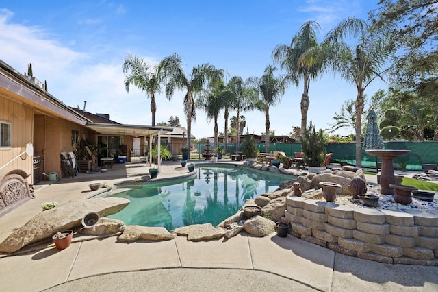 view of pool featuring a patio