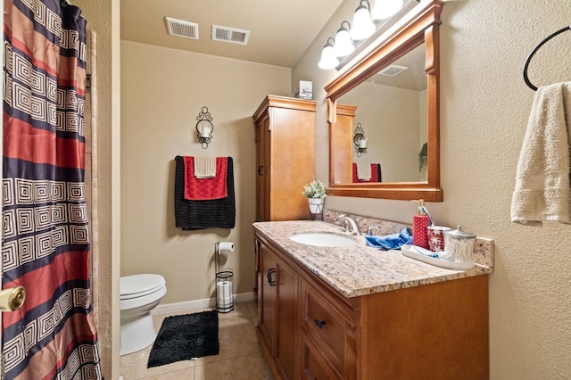 bathroom with tile patterned floors, vanity, toilet, and curtained shower