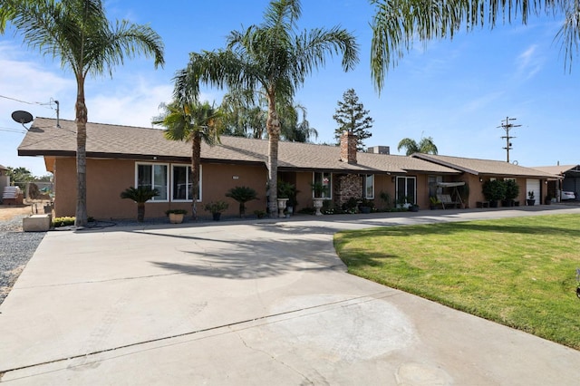 single story home with a front yard