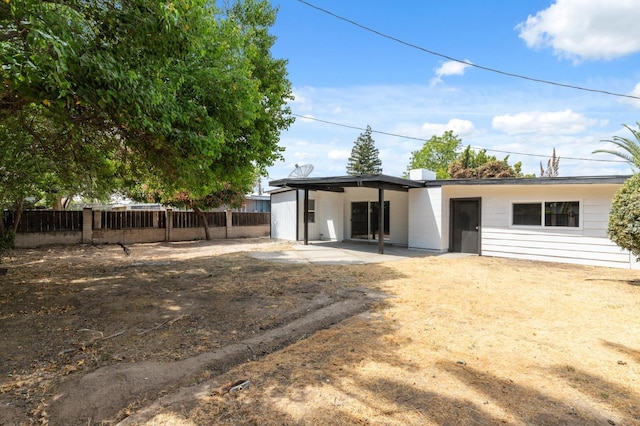 back of house featuring fence and a patio