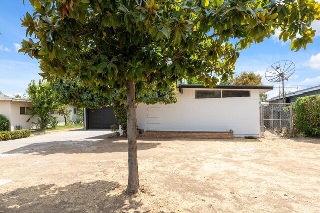 exterior space with a garage and concrete driveway