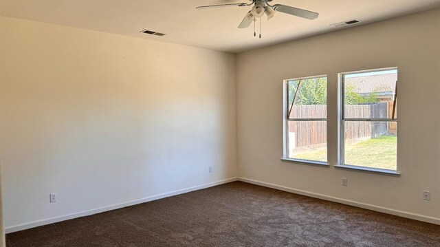 empty room with carpet flooring and ceiling fan