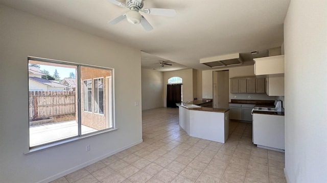 kitchen featuring plenty of natural light, ceiling fan, and light tile patterned floors