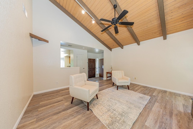 living area with ceiling fan, light hardwood / wood-style floors, wooden ceiling, and high vaulted ceiling