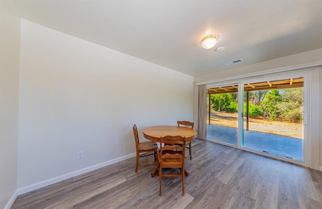 dining area with wood-type flooring