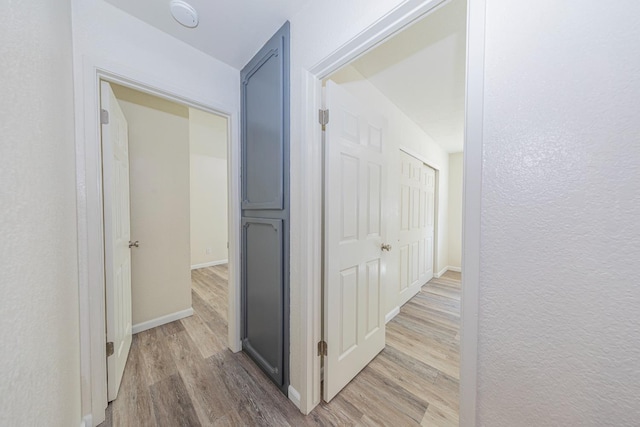 corridor featuring light wood-type flooring