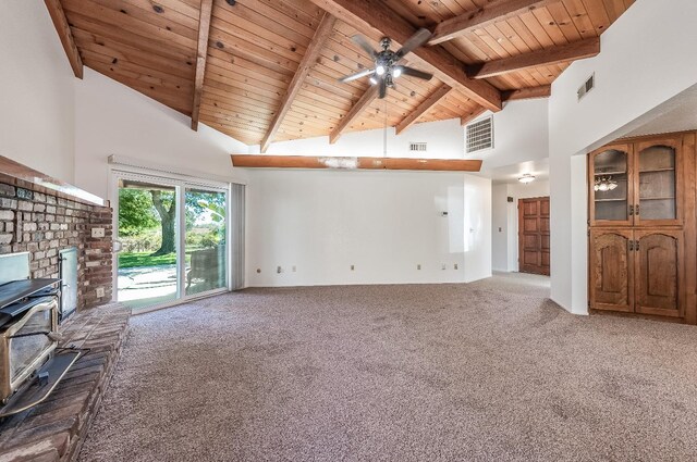 unfurnished living room with carpet, ceiling fan, high vaulted ceiling, and a wood stove