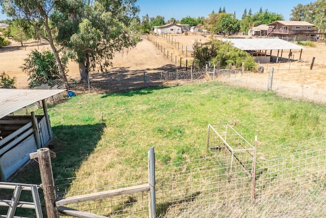 view of yard with a rural view