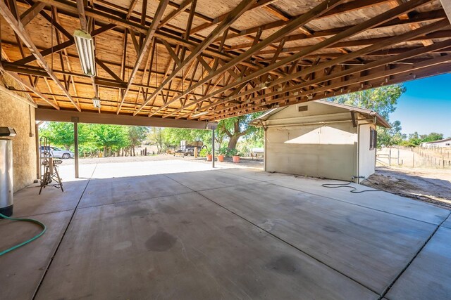 view of patio with a storage shed