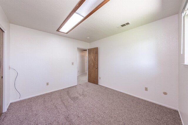 unfurnished room featuring carpet floors