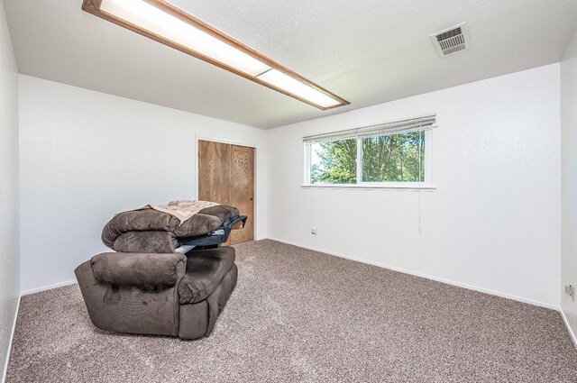 living area with carpet flooring