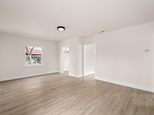 unfurnished room featuring light hardwood / wood-style flooring