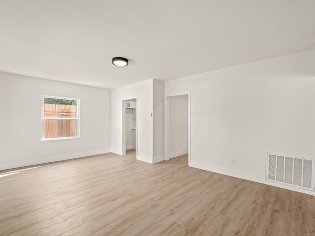 unfurnished room featuring light wood-type flooring