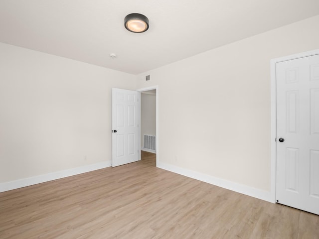 empty room with light wood-type flooring