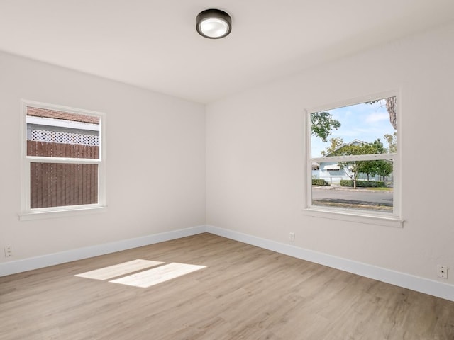 unfurnished room featuring light hardwood / wood-style flooring