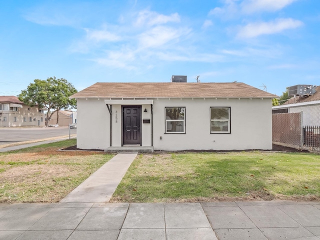 bungalow with a front yard