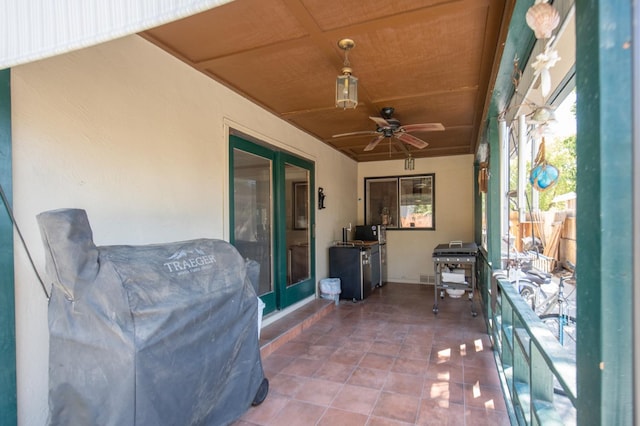 view of patio / terrace featuring a balcony, ceiling fan, and grilling area