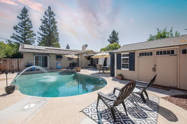 view of swimming pool with fence, a fenced in pool, and a patio