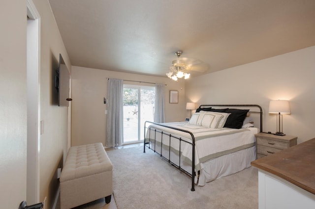 bedroom with access to outside, light carpet, and ceiling fan