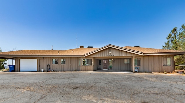 ranch-style house featuring a garage