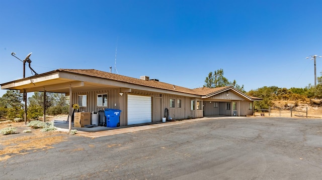 ranch-style house featuring a garage