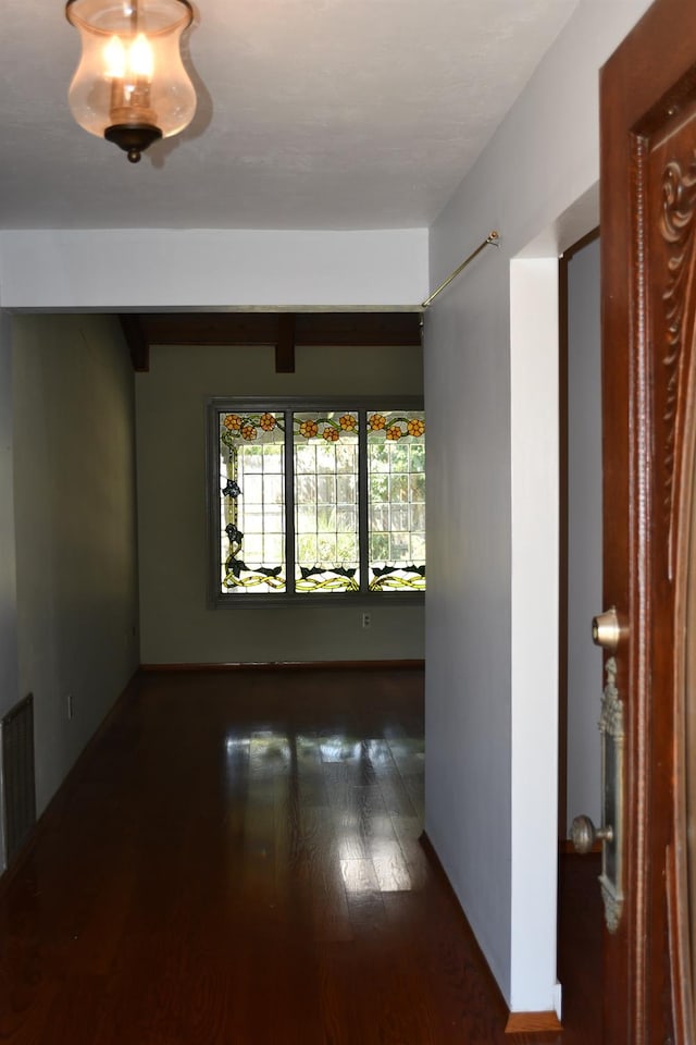 spare room with wood-type flooring