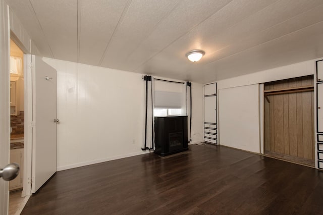 unfurnished living room featuring wood finished floors and a fireplace